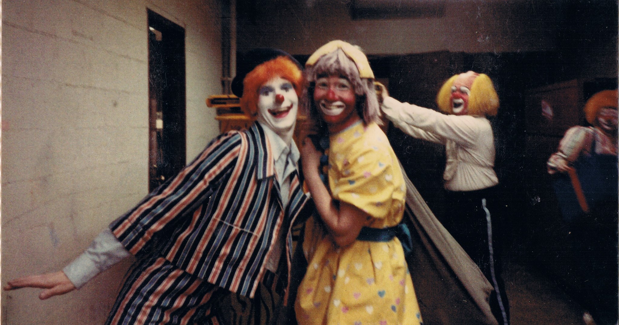 From left to right, Mike, John, and Karen are preparing for the Clown Gag in the center ring called School Daze. Yes, that's me in the middle, wearing a dress.
